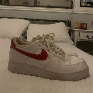 Women's Size 10 Nike Airforce Ones.White with red and gold embellishments.